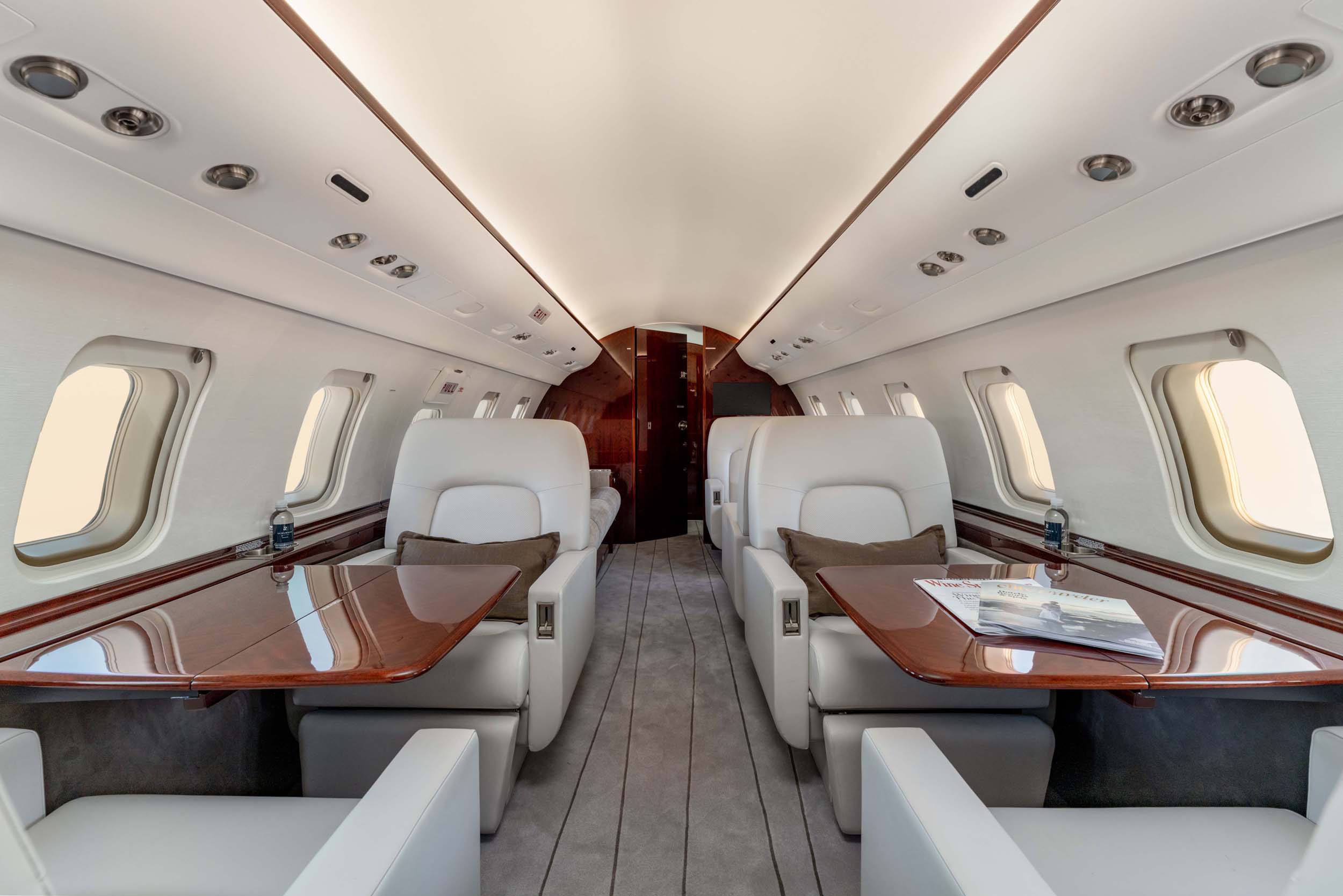CHALLENGER 605 private jet interior seats and tables
