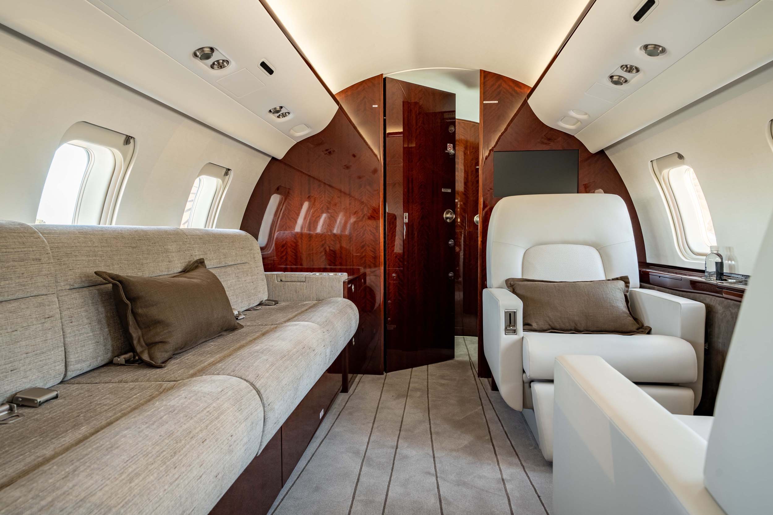 CHALLENGER 605 private jet interior sofa and chairs
