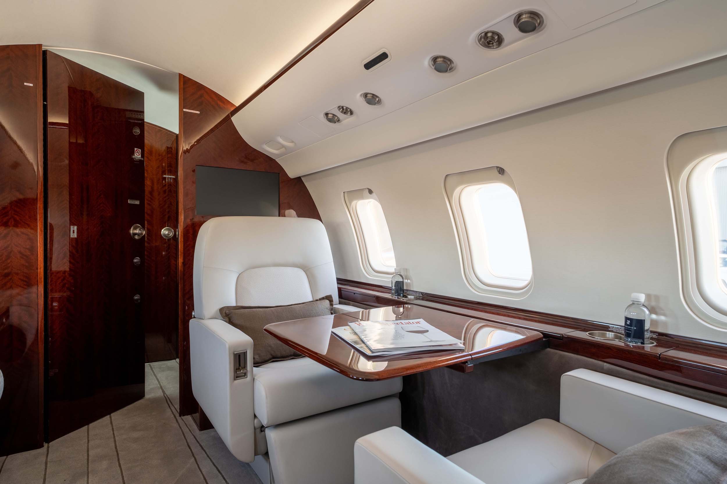 CHALLENGER 605 private jet interior seat and table