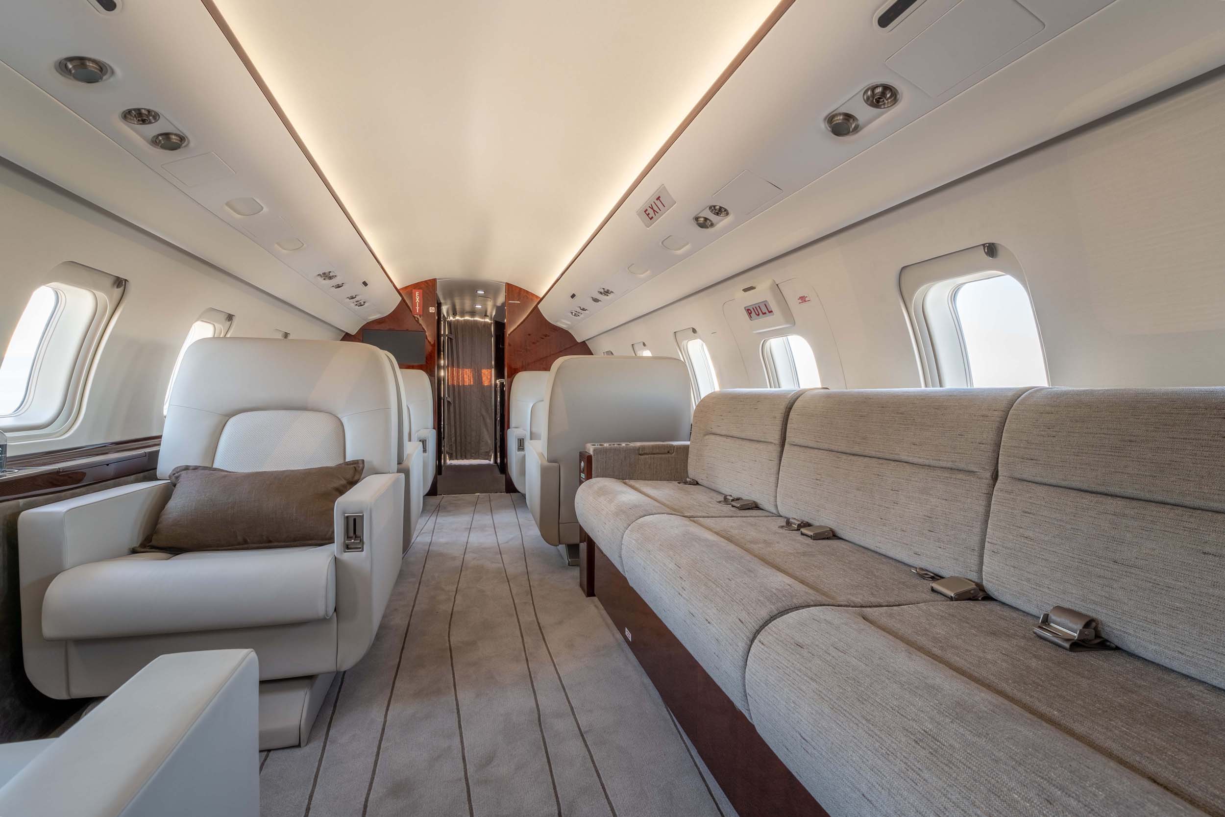 CHALLENGER 605 private jet interior sofa and chairs