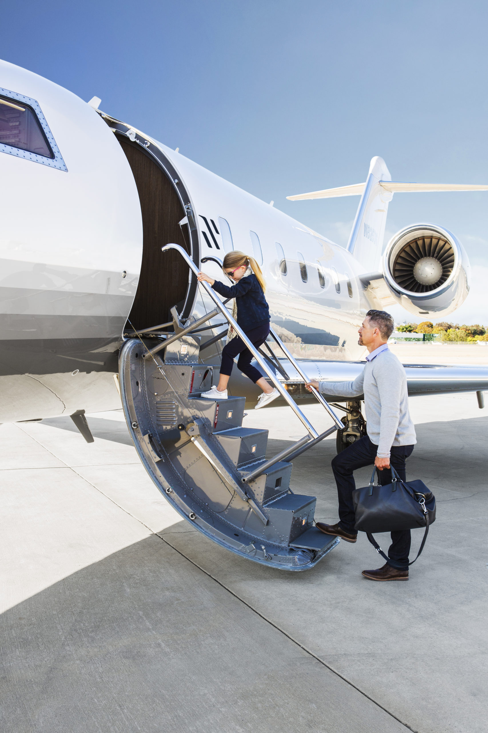 Family entering private jet