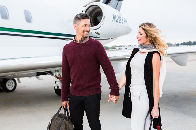 Couple boarding private jet